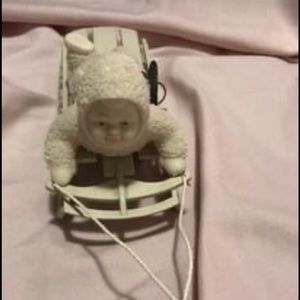 Three Snowbabies on the sled